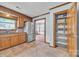 Well-appointed kitchen with stainless steel refrigerator and pantry at 1921 Wexford Ct, Gastonia, NC 28054