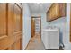Well-equipped laundry room with washer, dryer, cabinets, and a tiled floor at 1921 Wexford Ct, Gastonia, NC 28054