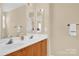 Bright bathroom featuring double sinks, spacious vanity, and well-lit mirrors at 1965 Charlotte Hwy # 401, Mooresville, NC 28115
