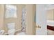Bathroom with a toilet, shower with curtain, and a small window at 1965 Charlotte Hwy # 401, Mooresville, NC 28115