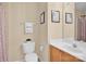 Bathroom featuring a toilet, a sink with cabinet, and a large mirror at 1965 Charlotte Hwy # 401, Mooresville, NC 28115