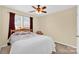 Bedroom featuring a large window with curtains and a comfortable bed at 1965 Charlotte Hwy # 401, Mooresville, NC 28115