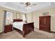 Relaxing bedroom featuring a tray ceiling, neutral walls, and large windows providing great natural light at 1965 Charlotte Hwy # 401, Mooresville, NC 28115