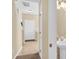Welcoming entryway featuring tile flooring, neutral walls, and access to a half bathroom and staircase at 1965 Charlotte Hwy # 401, Mooresville, NC 28115