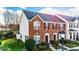 Charming brick townhome featuring a well-manicured lawn and inviting entryway, ideal for comfortable living at 1965 Charlotte Hwy # 401, Mooresville, NC 28115
