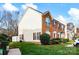 An end unit townhome with brick and vinyl siding and well-maintained landscaping at 1965 Charlotte Hwy # 401, Mooresville, NC 28115
