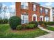 Charming brick townhome with neat landscaping and a well-maintained lawn at 1965 Charlotte Hwy # 401, Mooresville, NC 28115