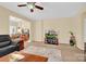 The bright living room offers carpeted floors, neutral walls, and great natural light at 1965 Charlotte Hwy # 401, Mooresville, NC 28115