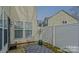 Outdoor patio with white fence and woven chairs at 1965 Charlotte Hwy # 401, Mooresville, NC 28115