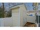 A backyard storage shed with siding and a door is accessible from the fenced backyard at 1965 Charlotte Hwy # 401, Mooresville, NC 28115