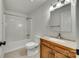 Bathroom with tub and shower combination and granite vanity at 210 Knox St, Clover, SC 29710