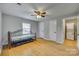 Bedroom features hardwood floors, a ceiling fan and ample natural light at 210 Knox St, Clover, SC 29710
