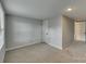 Bedroom with neutral walls and carpet, featuring a closet at 210 Knox St, Clover, SC 29710