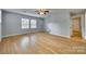 Bright living room with hardwood floors, plenty of natural light and access to other rooms at 210 Knox St, Clover, SC 29710