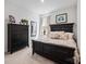 Charming bedroom with dark wood furniture and decorative accents at 22014 Finworthy Ln, Huntersville, NC 28078