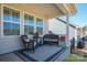 Inviting covered porch featuring comfortable seating and serene outdoor ambiance at 22014 Finworthy Ln, Huntersville, NC 28078