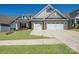 Beautiful brick and siding home showcasing a manicured lawn and a convenient two-car garage at 22014 Finworthy Ln, Huntersville, NC 28078