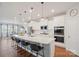 Modern kitchen with white cabinets, quartz countertops, and stainless steel appliances at 22014 Finworthy Ln, Huntersville, NC 28078