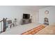 Living room with soft carpet, neutral colors and a flatscreen TV with stand at 22014 Finworthy Ln, Huntersville, NC 28078