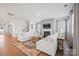 Living room view showcasing a fireplace, plush sofas, and hardwood floors at 22014 Finworthy Ln, Huntersville, NC 28078
