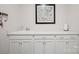 Mud room with large counter space, white cabinets and sleek fixtures at 22014 Finworthy Ln, Huntersville, NC 28078