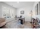 Bright office space with a large window, shutters, and desk with decorative lighting at 22014 Finworthy Ln, Huntersville, NC 28078