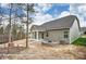 Backyard featuring patio, fire pit, green siding, and a large tree at 2252 Tabor Rd # 575, Sherrills Ford, NC 28673