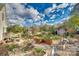 Scenic backyard with raised garden beds, stone pathways, and a charming pergola at 2331 Gill Jordan Rd, Chester, SC 29706