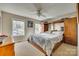 Well-lit bedroom with a ceiling fan, large bed, and closet space at 2331 Gill Jordan Rd, Chester, SC 29706
