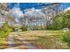 Beautiful home surrounded by a large, well-maintained front yard and lush trees at 2331 Gill Jordan Rd, Chester, SC 29706
