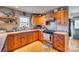 Functional kitchen featuring wood cabinetry, gas range, and ample countertop space at 2331 Gill Jordan Rd, Chester, SC 29706
