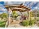 Cozy wooden patio area with a pergola, seating, and plants for a relaxing atmosphere at 2331 Gill Jordan Rd, Chester, SC 29706
