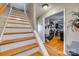 Stairway with hardwood steps and white risers leading to the upper level at 2331 Gill Jordan Rd, Chester, SC 29706