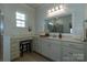 Bright bathroom features a vanity with lots of cabinets and a framed mirror at 246 Sweet Briar Dr, Fort Mill, SC 29707