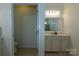 Bright bathroom featuring a vanity with white cabinets and drawers and a tile floor at 246 Sweet Briar Dr, Fort Mill, SC 29707