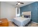 Cozy bedroom with a textured accent wall, soft lighting, and stylish furnishings at 246 Sweet Briar Dr, Fort Mill, SC 29707
