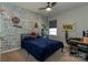 Stylish bedroom showcasing a cozy bed, ceiling fan, and unique brick-patterned accent wall at 246 Sweet Briar Dr, Fort Mill, SC 29707