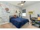 This bedroom features a brick accent wall, ceiling fan, and an area for gaming at 246 Sweet Briar Dr, Fort Mill, SC 29707