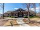 Charming community clubhouse featuring stone accents, a covered porch, and landscaped surroundings at 246 Sweet Briar Dr, Fort Mill, SC 29707