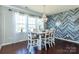 Dining area featuring a stylish chandelier, decorative accent wall and lots of sunlight at 246 Sweet Briar Dr, Fort Mill, SC 29707