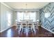 Formal dining room with decorative chandelier and wood accent wall at 246 Sweet Briar Dr, Fort Mill, SC 29707