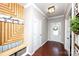 Inviting entryway features custom wood accent wall, storage bench, and a decorative welcome sign at 246 Sweet Briar Dr, Fort Mill, SC 29707