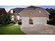 Charming home exterior with a stone facade, two-car garage, and manicured lawn at 246 Sweet Briar Dr, Fort Mill, SC 29707