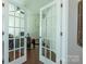 Open home office with glass doors and hardwood floors, providing a bright workspace at 246 Sweet Briar Dr, Fort Mill, SC 29707