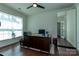 Bright home office featuring hardwood floors, a large desk, and ample natural light at 246 Sweet Briar Dr, Fort Mill, SC 29707