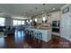 Spacious kitchen featuring a large island, granite countertops, modern appliances, and an open view to the dining area at 246 Sweet Briar Dr, Fort Mill, SC 29707