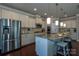 Well-lit kitchen with stainless steel appliances, a spacious island with a sink, and ample counter space at 246 Sweet Briar Dr, Fort Mill, SC 29707