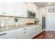 Close up of gourmet kitchen with stainless appliances, granite countertops, and stylish backsplash at 246 Sweet Briar Dr, Fort Mill, SC 29707