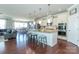 Open kitchen with island seating, stainless appliances, and view to dining area and living room at 246 Sweet Briar Dr, Fort Mill, SC 29707