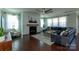 Spacious living room boasts a stone fireplace, large windows, and cozy seating arrangement at 246 Sweet Briar Dr, Fort Mill, SC 29707